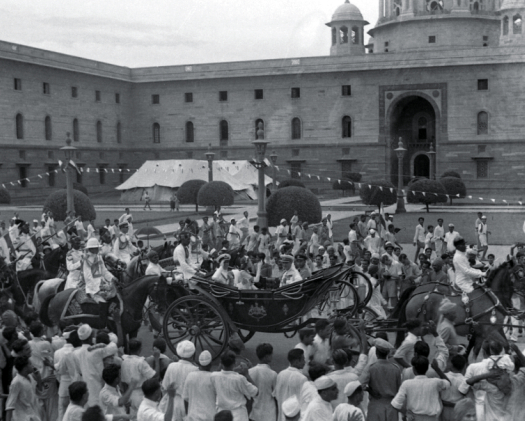 The ceremonial coach carrying Lord and Lady Mountbatten at a point between South Block (to the right) and North Block.