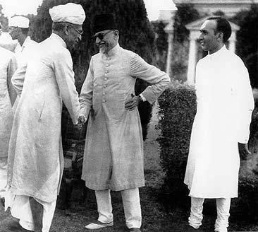 Maulana Azad Id party on August 18, 1947. Centre: Maulana Azad\; left S. Radhakrishnan (later President of India)\; right unidentified.