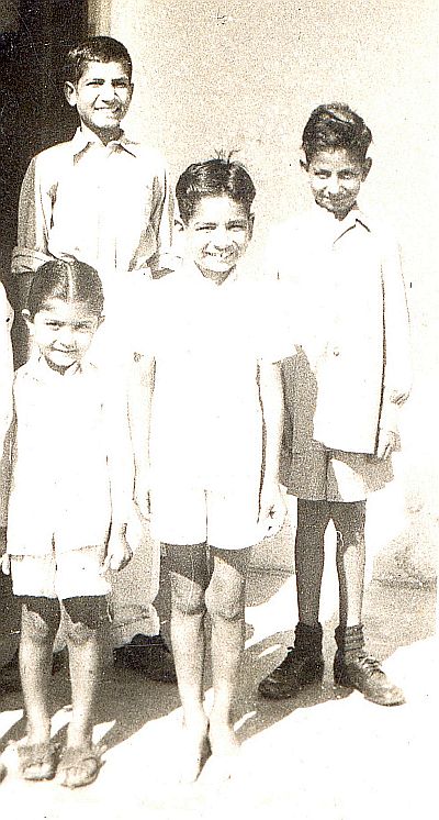 L to R: Madhu Khera (cousin), Juginder, Krishan (brother) Behind Virinder (brother). About 1952.