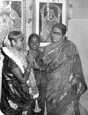 Patti (centre) at her daughter's wedding in August, 1974. At Patti's left is a friend.
