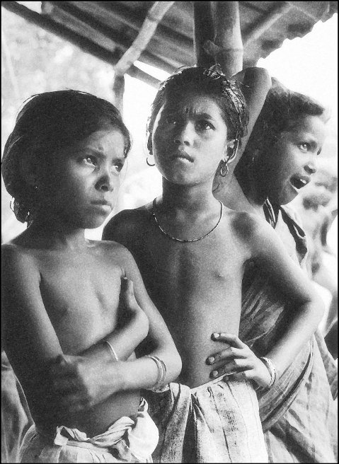Dhop Dhopi children as they watched the downpour. 24-Paraganas, West Bengal. Mid-1960s.